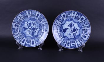 Two porcelain dishes with compartments on the outside, including a swastica decor, the center with a