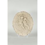 A plaster (paat) wall ornament depicting (2) putti. ca. 1910.
