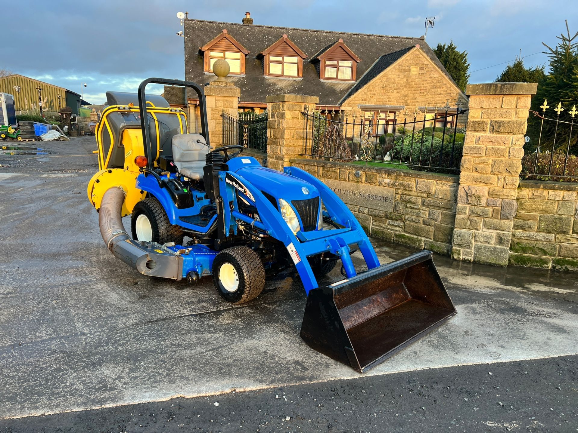 TZ25DA 25HP 4WD Compact Tractor With 54” Underslung Deck, Front Loader And Matev Rear Collector