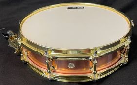 Piccolo snare drum, 14 x 3.5" in copper with gold coloured hoops and housings