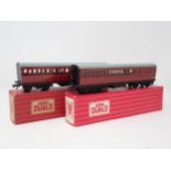 A pair of Hornby Dublo 4021 and 4022 BR Suburban Coaches, both in mint condition showing no signs of