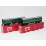 A rare pair of Hornby Dublo 4025 and 4026 Suburban Coaches with black ends, mint condition, boxes Ex