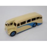 A Dinky Toys No.29e Single Deck Bus, cream and blue with blue hubs, mint condition. Ideal for layout