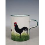 A Wemyss Ware large Mug, decorated chickens, with green rim and handle, 5½in H, impressed mark and