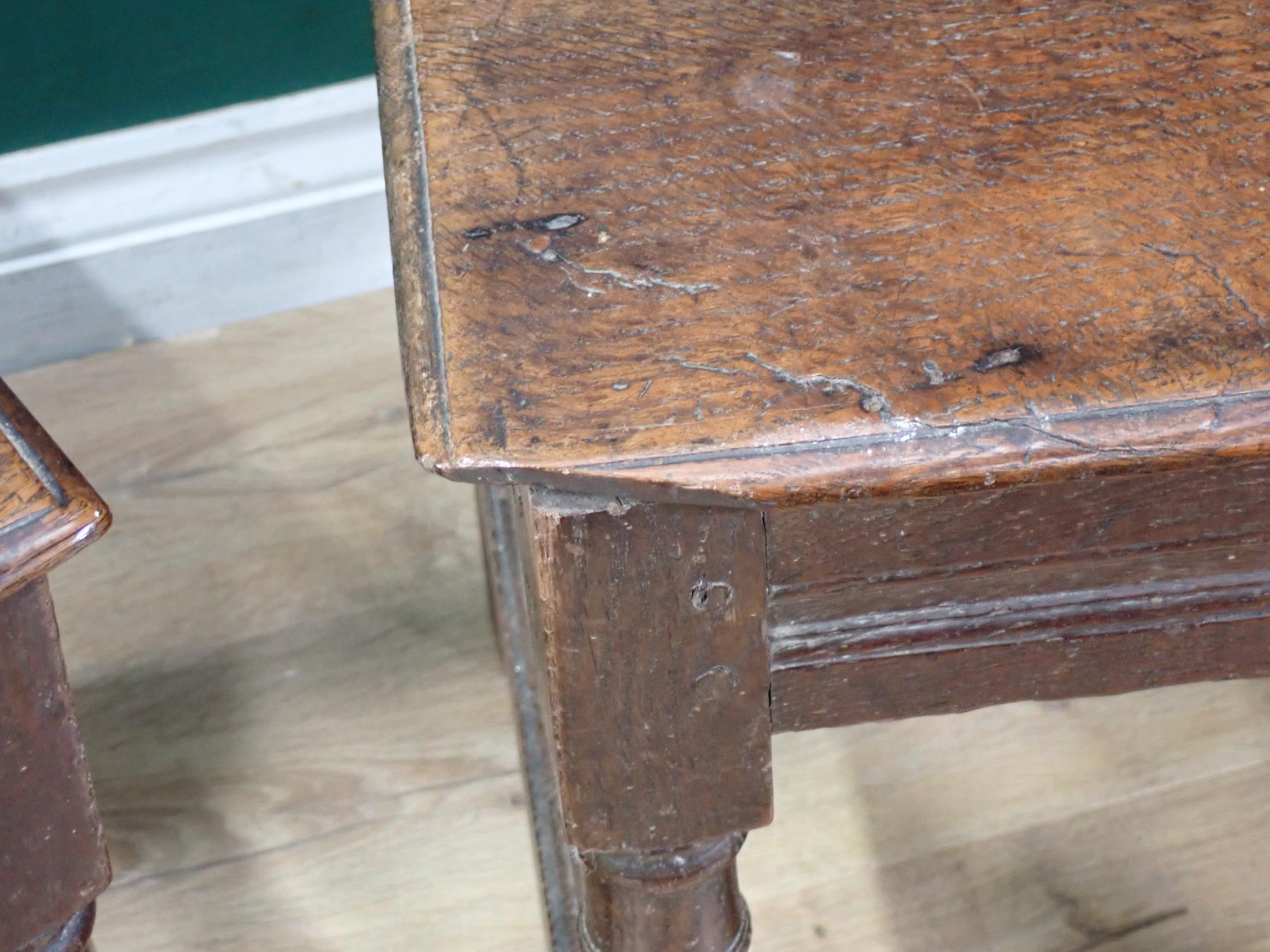 A pair of 17th Century oak Hall Chairs with pierced shaped crests above foliate carved panel - Image 3 of 6