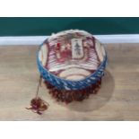 A 19th Century upholstered Cushion Stool with central armorial crest, raised on four shaped walnut