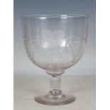 A 19th Century engraved glass Mammoth Goblet, finely engraved with a trailing fruiting vine design