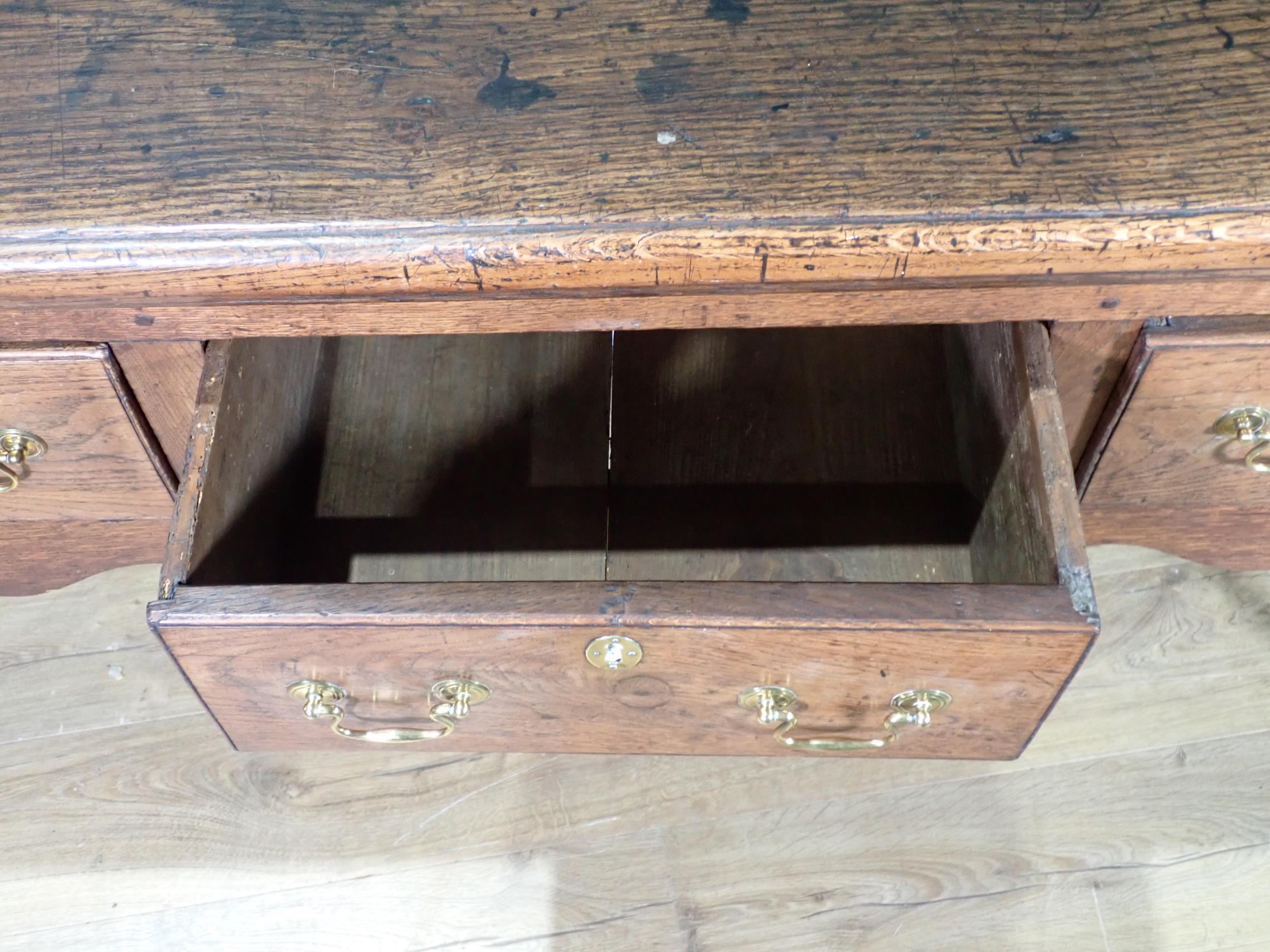 An 18th Century oak Dresser Base with thick moulded top fitted three frieze drawers above shaped - Image 11 of 12