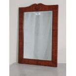 An Arts & Crafts rosewood framed rectangular Wall Mirror with chevron stringing, stylised floral