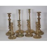 A tall pair of brass Candlesticks on fine straight stems and circular bases in the 18th Century