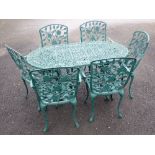 A green painted metal Garden Table 4ft 7in W x 2ft 4in H and six Chairs with trailing rose back (one