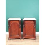 A pair of 19th Century mahogany Bedside Chests with marble tops and raised on later turned supports,