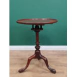 A George II mahogany Pillar Table with circular top, mounted on bird cage action and turned