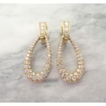 A pair of Diamond Hoop Ear Clips each pavé-set throughout with numerous brilliant-cut stones in 18ct
