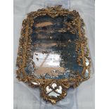 An 18th Century giltwood framed Wall Mirror with circular leafage and pendant design, 4ft 3in x