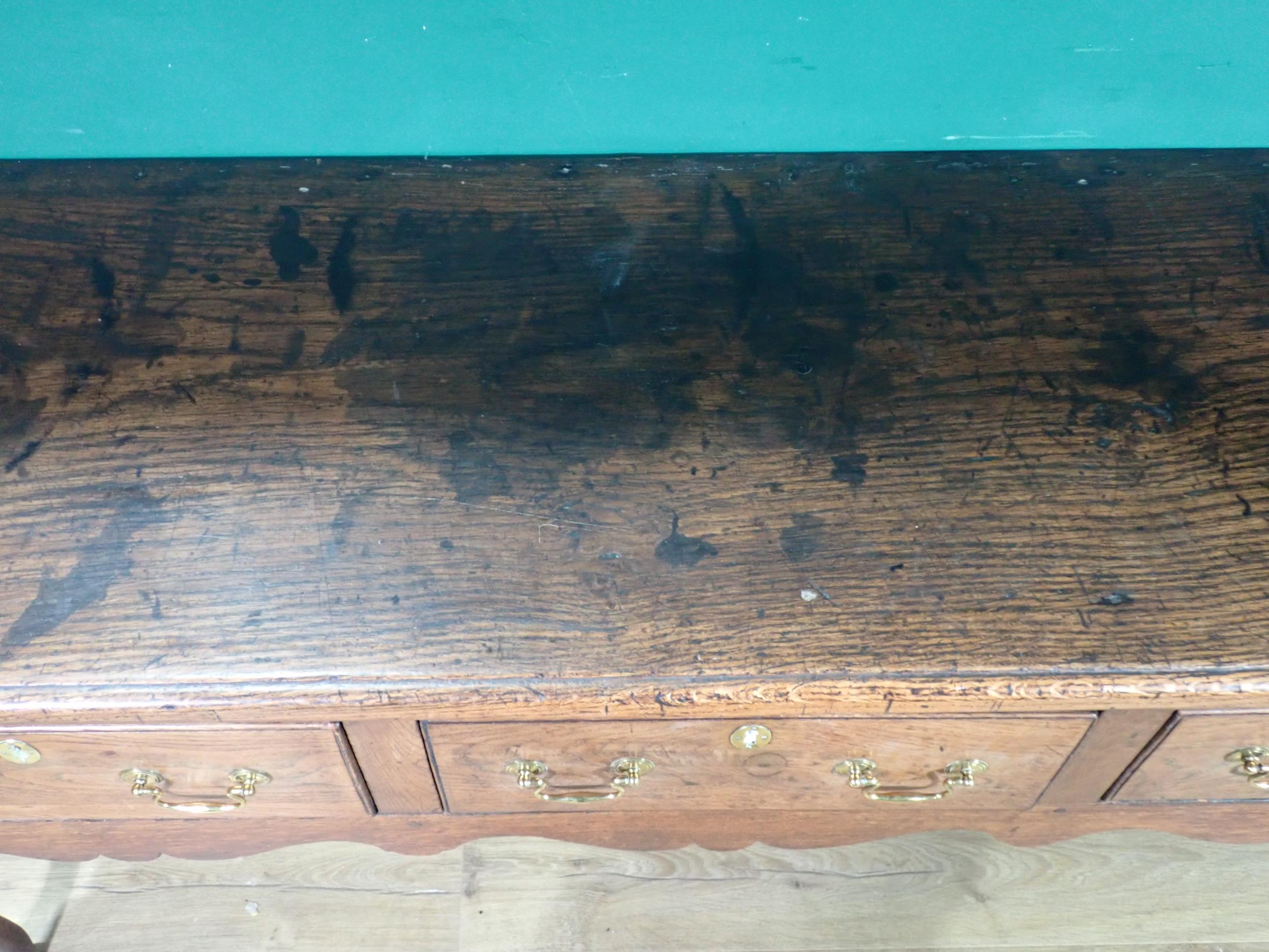 An 18th Century oak Dresser Base with thick moulded top fitted three frieze drawers above shaped - Image 4 of 12