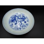 A Chinese blue and white shallow Saucer Dish, painted dragon to centre and exterior, 6¾in, six