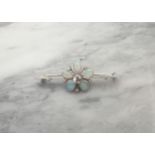 A Diamond and Opal Flower Brooch claw-set old-cut diamond within five pear shaped opal cabochons and