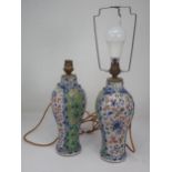 A pair of Chinese ceramic baluster Vases with green and white panels with painted floral designs