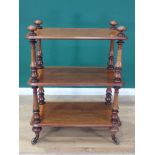 A Victorian walnut three tier Buffet on turned supports and brass casters 3ft 7in H x 2ft 9in W