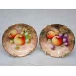 A small pair of Royal Worcester circular Dishes painted still life of fruit, apples and grapes