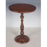 A 19th Century Adjustable Rosewood and mahogany Candle Stand, the circular top above turned column