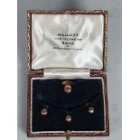 A set of four 9ct gold Shirt Studs by Mallett of Bath and New Bond Street, in original box