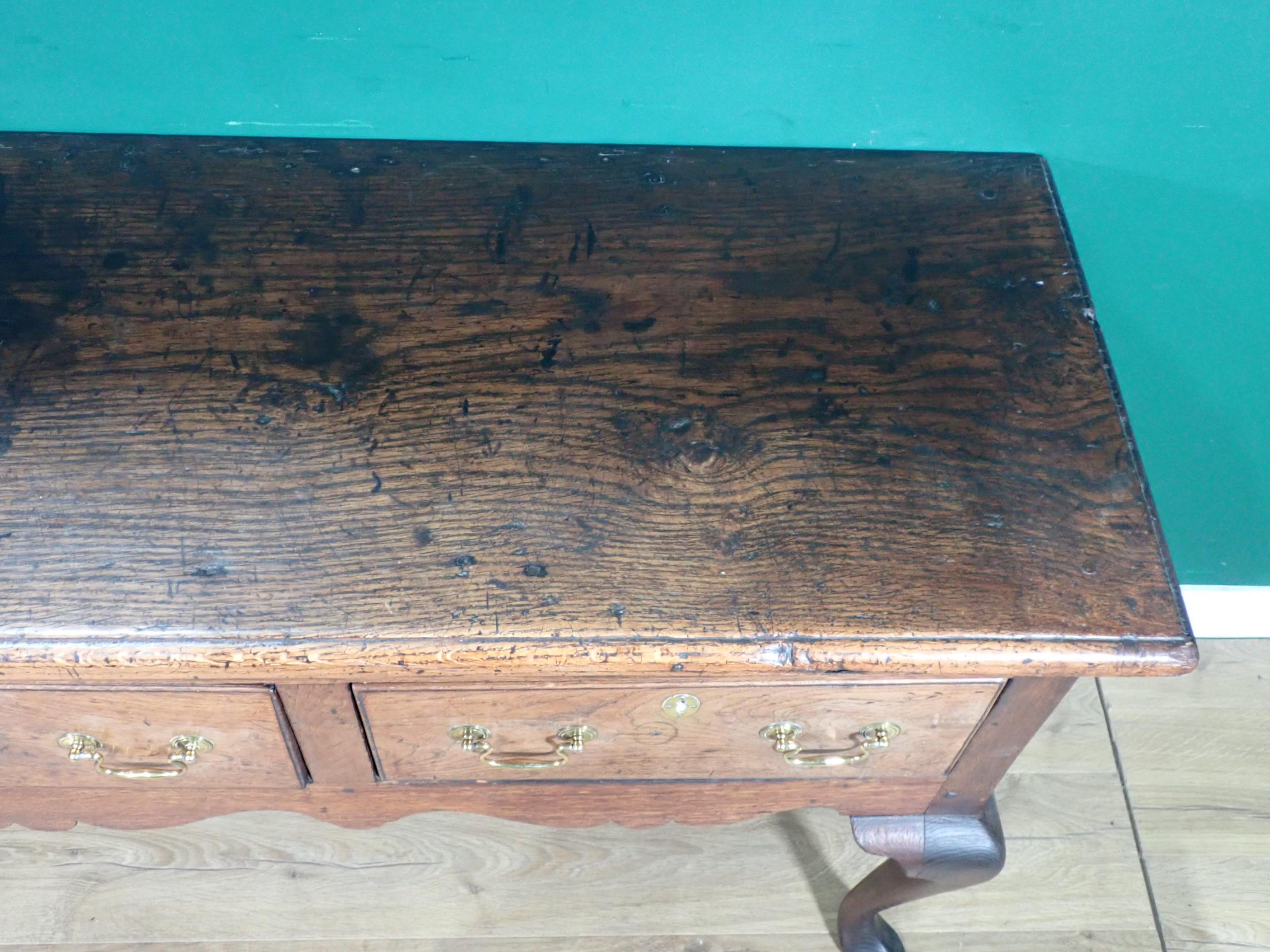 An 18th Century oak Dresser Base with thick moulded top fitted three frieze drawers above shaped - Image 5 of 12