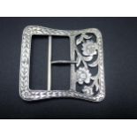 A George V silver Nurse's Buckle of rectangular form with floral pierced and engraved design,
