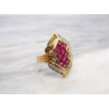 A Ruby and Diamond Cocktail Ring invisibly-set ten calibré-cut rubies within brilliant-cut