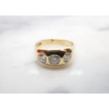 A Diamond three stone Ring gypsy-set graduated brilliant-cut stones (centre stone chipped),