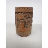 An Oriental bamboo Brush Pot, finely carved and pierced with figures in a landscape, 6in