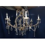 An elaborate six-branch glass and gilt metal Electrolier with scrolled supports and arms,