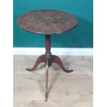 An 18th Century country oak Pillar Table, the circular tilt top mounted on turned column and