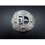 A Dutch silver Nurse's Buckle of shaped oval form with scroll design, circa 1900