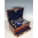 A 19th Century rosewood ladies Dressing Case, with plated fitted interior, the interior of the cover