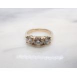 A Diamond three stone Ring claw-set brilliant-cut stones, total diamond weight 1.64cts, in 18ct