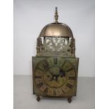 A 17th Century style brass cased lantern type Clock with circular dial inscribed Jn Fordham,