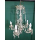A five branch glass Chandelier with baguette drops and swags and bulbous central column, 20 x 23in H
