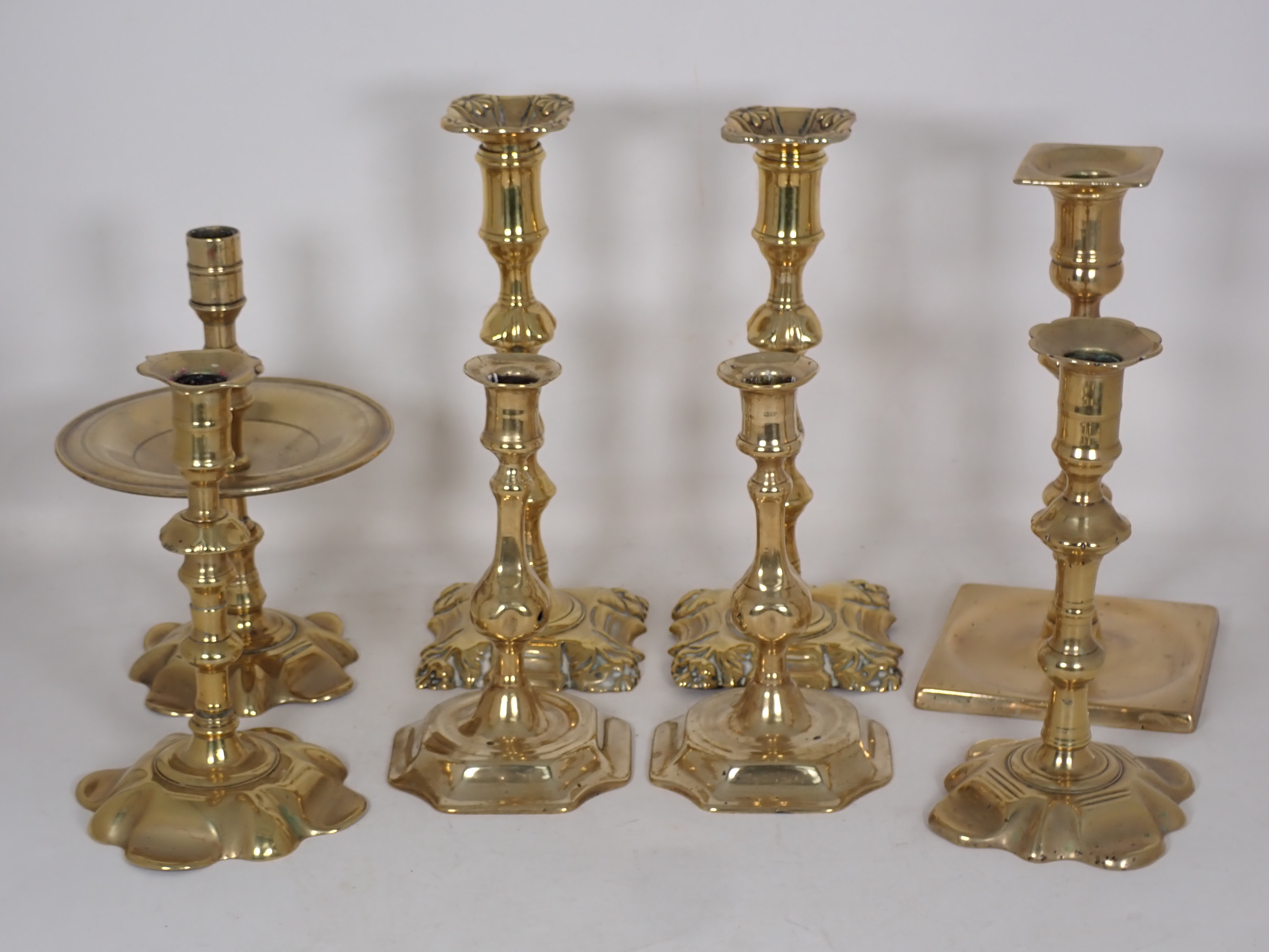 Three pairs of brass Candlesticks in the 18th Century style, another 18th Century Candlestick with