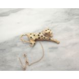A 9ct gold gem-set Leopard Brooch, approx 5cms wide, approx 8.60gms