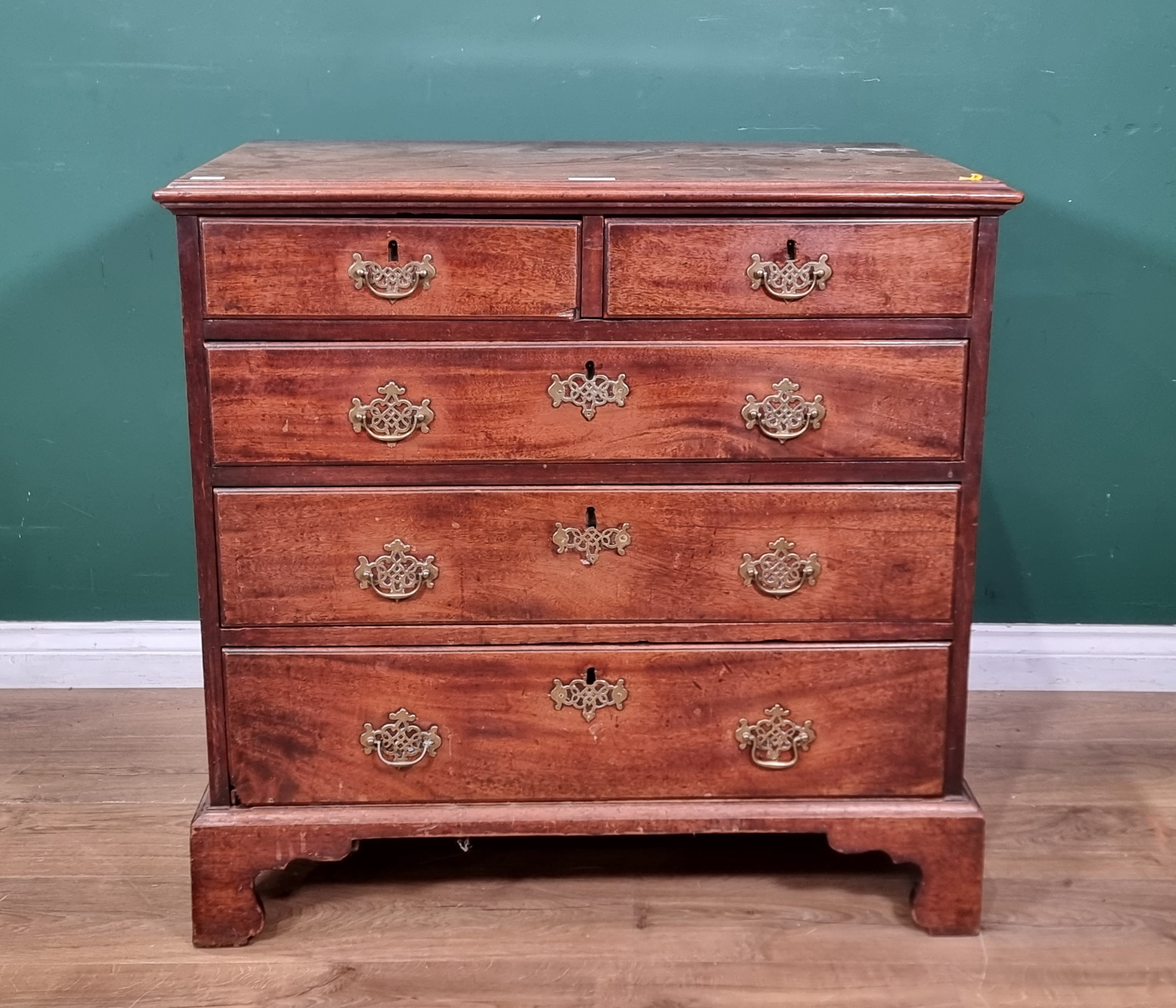 A George III mahogany Chest of two short and three long drawers on bracket feet, 2ft 9in wide