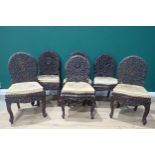 A set of six Burmese carved Chairs, the floral pierced backs with carved birds to the centres and