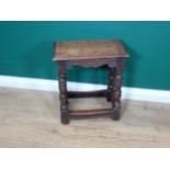 An Elizabethan style oak Joint Stool with carved and shaped frieze raised on turned and carved cup