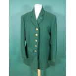A Heythrop Hunt Gentleman's green Coat with brass H.H. buttons and tattersall lining