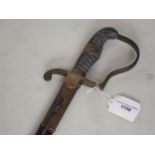 A Prussian Wilhelm I Cavalry Sabre with brass stirrup hilt, sharkskin grips and 84 e.m. pipe back