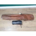 An antique leather Golf Bag and a pair of Gaiters