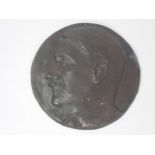 A bronze Medallion showing side profile of Adolf Hitler, initialled J.M.S., 4in D. Reputedly part of