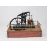 A Stothert and Pitt Beam Engine Model on brick effect base, finished to a fine standard 12 1/2in L x