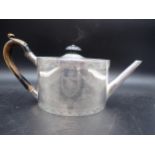 An Edward VII silver oval Teapot of unusually large proportions, finely engraved floral swags and